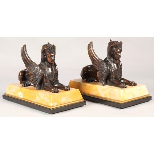 252 - Pair of bronze Egyptian revival winged Sphinx on marble base, overall length 28 cm  (2)