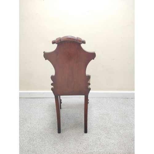 481 - Victorian mahogany hall chair with shaped scroll back bearing scroll cartouche to the centre on spin... 