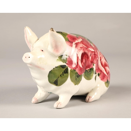 22 - Wemyss ware pig, hand painted with cabbage rose decoration, 16cm long.