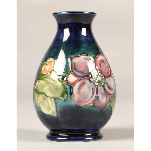 7 - Moorcroft pottery vase in the clematis pattern, 13cm high.