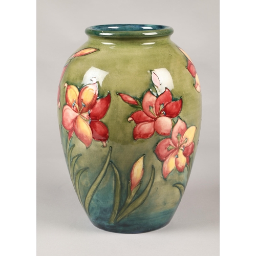 15 - Large Moorcroft pottery vase in the hibiscus pattern, (some damage) 33cm high.