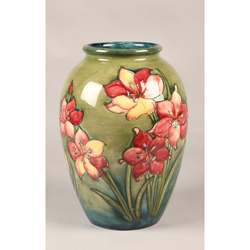 15 - Large Moorcroft pottery vase in the hibiscus pattern, (some damage) 33cm high.