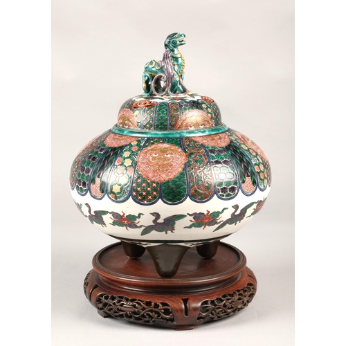 201 - Japanese pottery censer with cover, finial with two dragons, marks to base,  on hardwood stand, 33cm... 