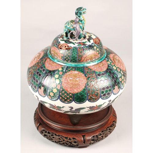 201 - Japanese pottery censer with cover, finial with two dragons, marks to base,  on hardwood stand, 33cm... 