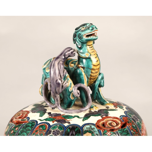 201 - Japanese pottery censer with cover, finial with two dragons, marks to base,  on hardwood stand, 33cm... 