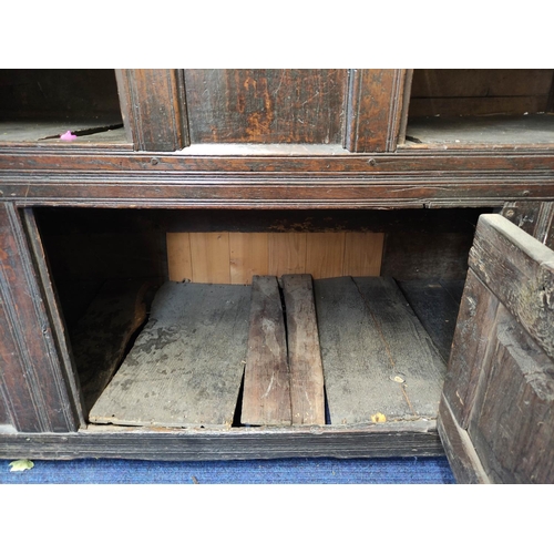 507 - William and Mary oak court cupboard inscribed to the frieze with initials and dated 1691, above foli... 