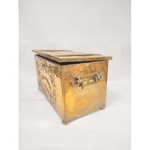 396 - Arts & Crafts brass log box decorated with embossed panel of a dragon, applied strapwork and han... 