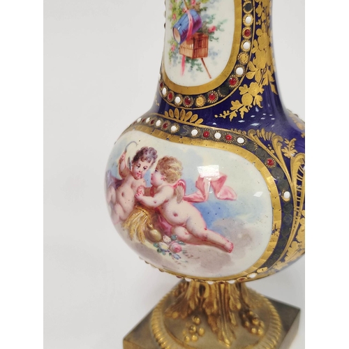 307 - Pair of Sevres style Continental porcelain vases decorated with panels of winged putti and objects o... 