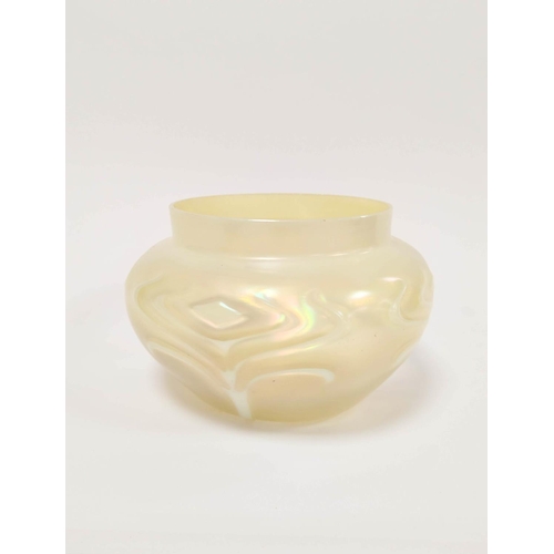 411 - Art Nouveau vaseline glass bowl impressed with raised stylised motifs, 14cm high.