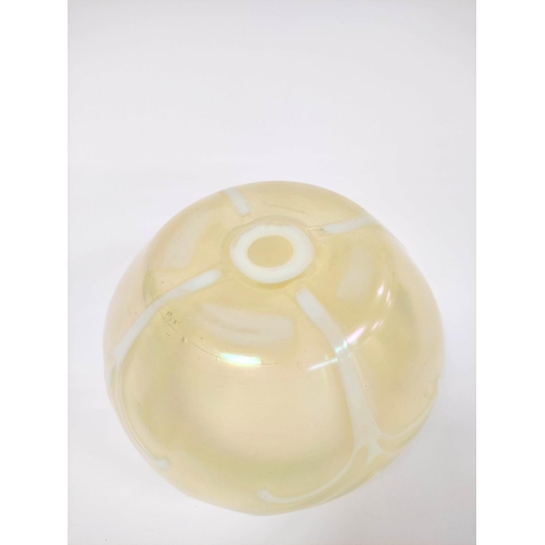 411 - Art Nouveau vaseline glass bowl impressed with raised stylised motifs, 14cm high.