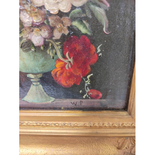 221 - Early 20th Century School.Still life of mixed flowers in a vase.Oil on board.Initialled WP,27cm x 15... 