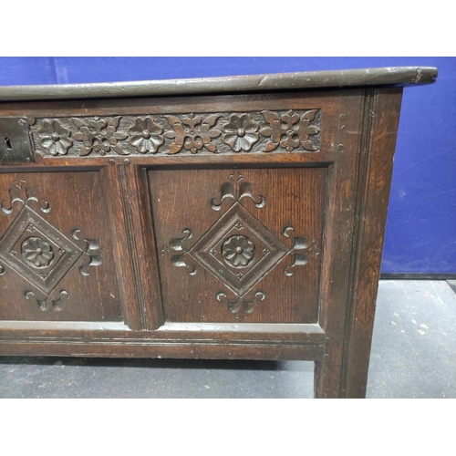 449 - Antique oak coffer with triple panelled front, with carved quatrefoils and frieze, the cover later (... 