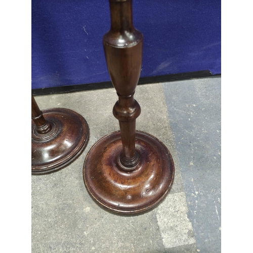 455 - Two 19th century pole screens with turned columns and finials with oval fabric panels on turned base... 