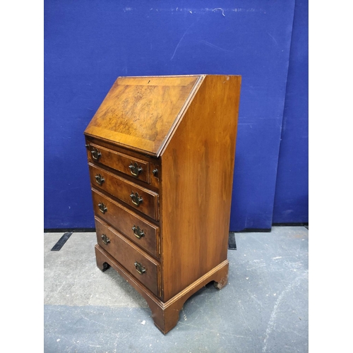 457 - Burr walnut small bureau of early 18th century style with four graduated drawers. H96cm W53cm D40cm