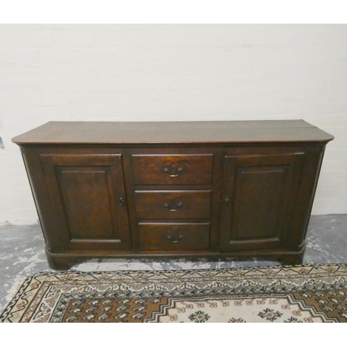 469 - Antique 18th century style oak dresser base with three central drawers flanked by cupboard doors, on... 