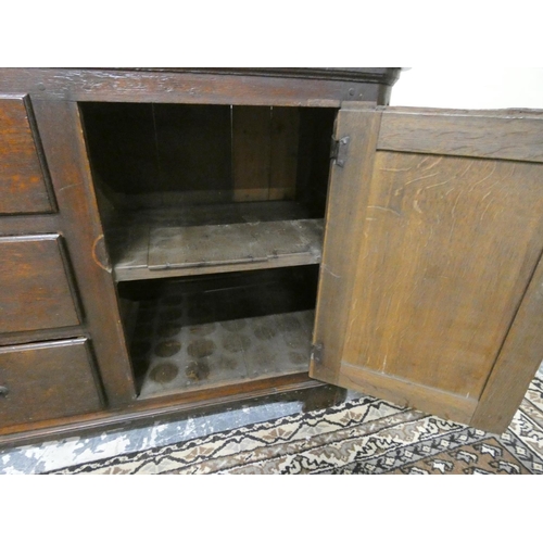 469 - Antique 18th century style oak dresser base with three central drawers flanked by cupboard doors, on... 