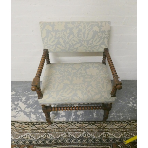 488 - Antique oak bobbin open armchair upholstered in later fabric, 78cm high.