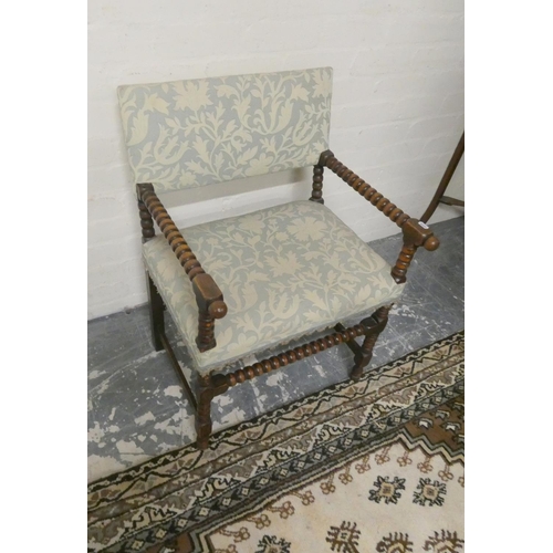 488 - Antique oak bobbin open armchair upholstered in later fabric, 78cm high.