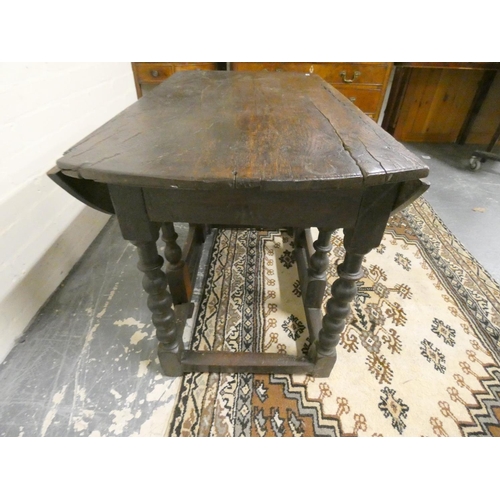 499 - Charles II and later oak gate-leg supper table with extending drop sides united by adjoining beam un... 