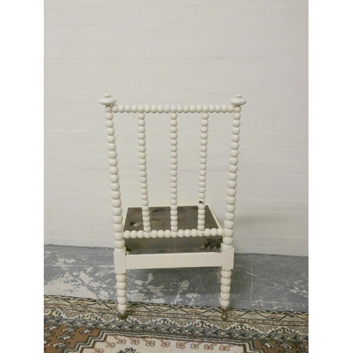 501 - Antique painted bobbin turned chair on brass caps and castors, 101cm high.