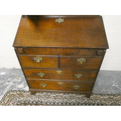 502 - 18th century oak bureau bookcase, the bookcase top with two panel doors enclosing shelved interior a... 