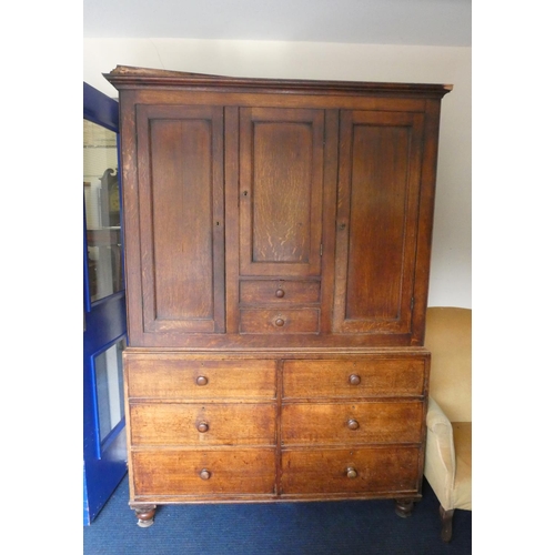 506 - Georgian oak linen press cupboard circa early 19th century of large proportions, the top section wit... 