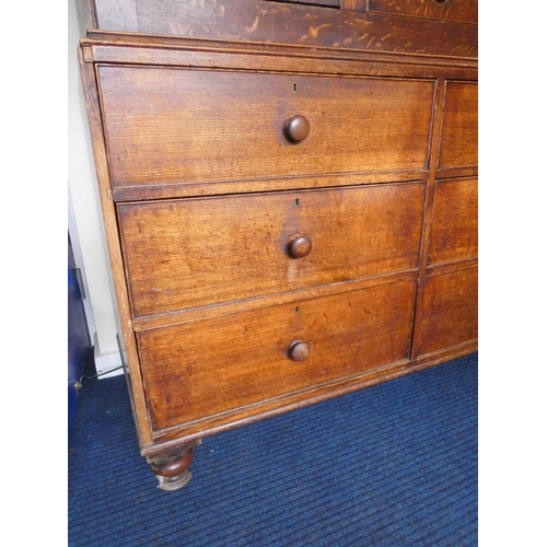 506 - Georgian oak linen press cupboard circa early 19th century of large proportions, the top section wit... 