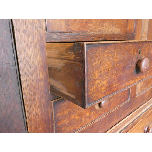 506 - Georgian oak linen press cupboard circa early 19th century of large proportions, the top section wit... 