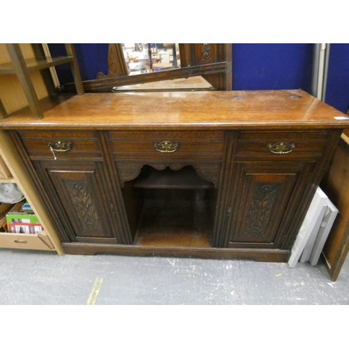 489 - Edwardian carved oak sideboard.