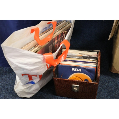 100 - Box containing singles, and a bag containing LPs.