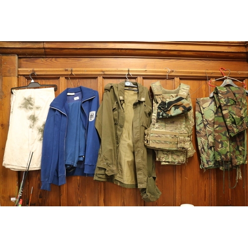 102 - Army uniform to include camouflage trousers, a bib, a khaki jacket, a German Bundswehr tracksuit, et... 