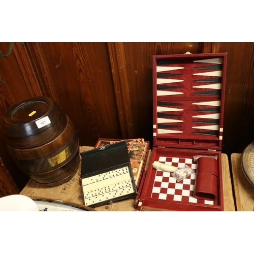 107 - Remy Martin Cognac games compendium in the shape of a barrel, a boxed set of dominoes, a bridge set,... 