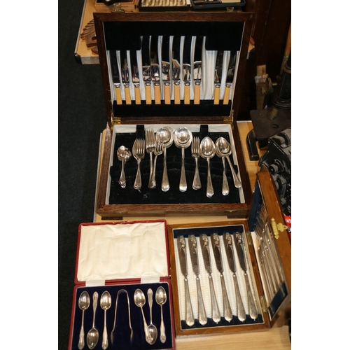 152 - Three cased sets of flatware to include teaspoons and tongs, fish knives and forks, etc.