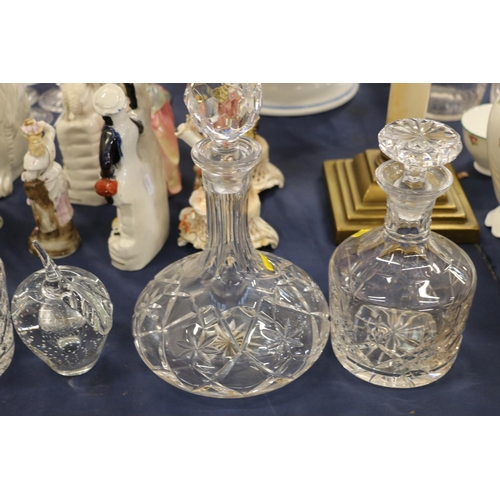 216 - Glass decanters and a glass apple paperweight.