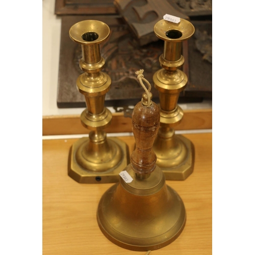 262 - Pair of brass candlesticks and a school yard bell.