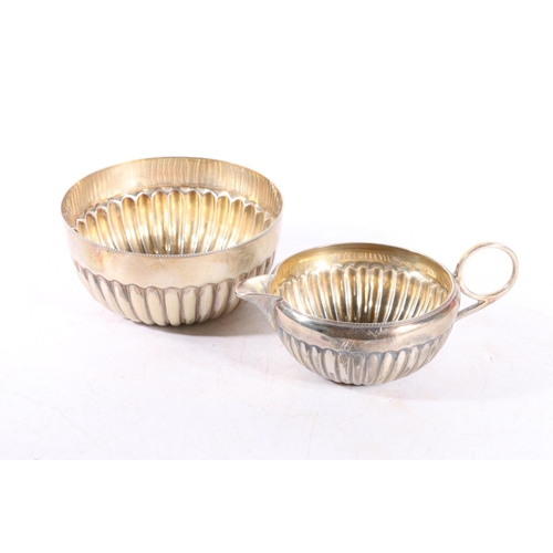 586 - Victorian silver creamer and matching sugar bowl of half lobed form, in original fitted retailers ca... 