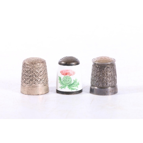 601 - Hallmarked silver thimble with hardstone top, Charles Horner Dorcas thimble and an enamel thimble wi... 