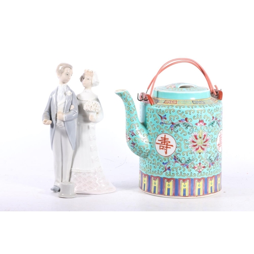 62 - Chinese turquoise ground teapot and a Lladro figure of a bride and groom.  (a/f)