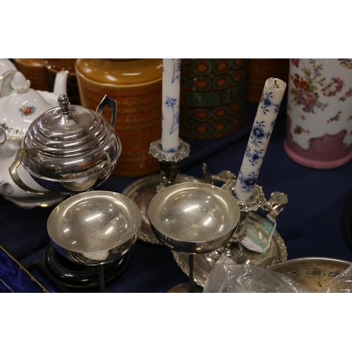 64 - Silver-plated ware to include a pair of chamber sticks, two Links of London goblets, a pierced shall... 