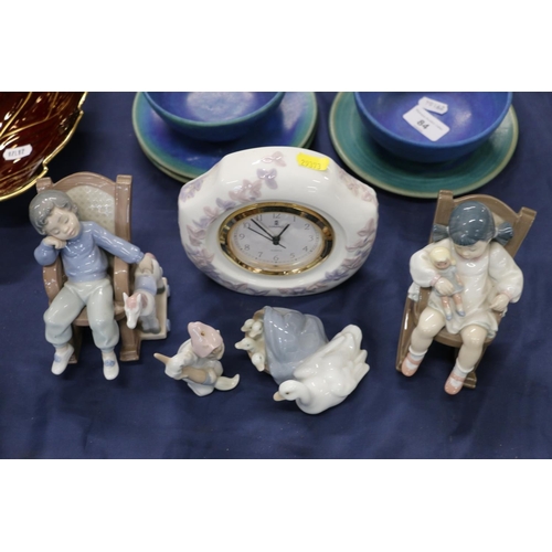 83 - Lladro to include a  clock, two figurines of children on rocking chairs, and other figurines.