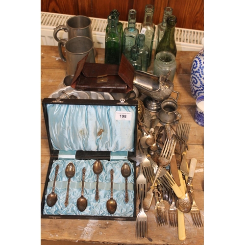 198 - Silver-plated flatware, pewter tankards, and glass bottles.