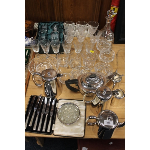 200 - Crystal to include decanters, wine glasses, and silver-plated items.