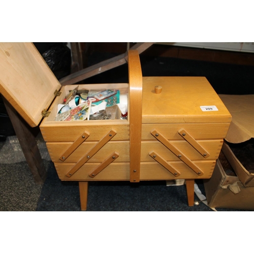 209 - Late 20th century cantilever sewing box containing threads, bobbins, etc.