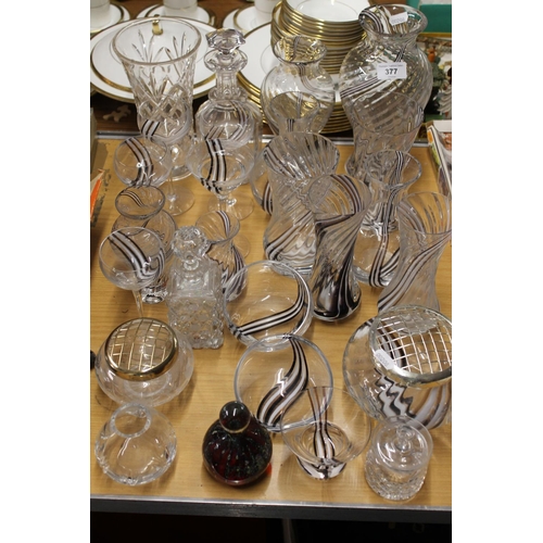 377 - Glassware to include Caithness vases, a Mdina paperweight, etc.