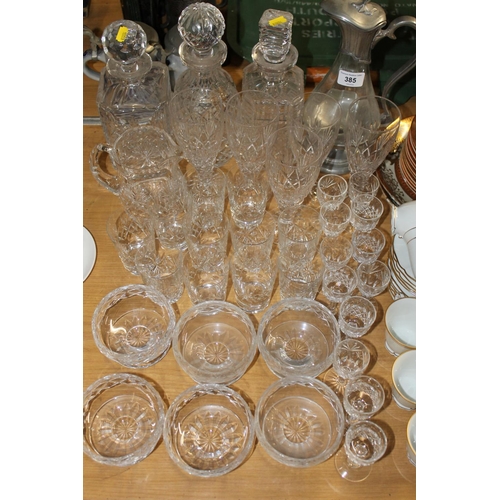 385 - Glassware to include decanters, a ewer, etc.