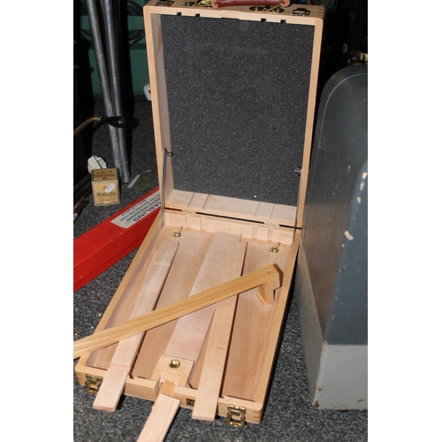 392 - Cased easel, etc.