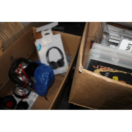 394 - Box containing CDs, headphones, etc.