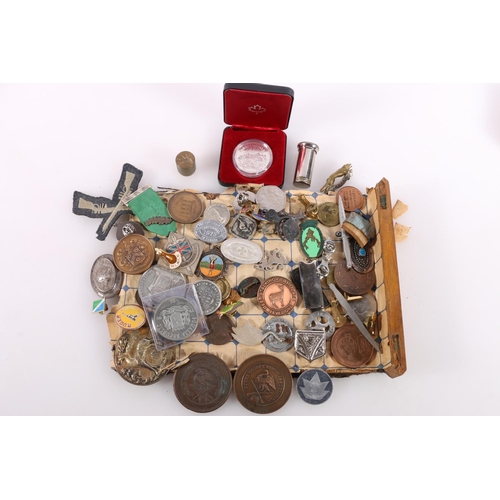 457 - Coins, medals and badges to include a Canadian dollar 1980 boxed, Bucks County Rifle Association med... 