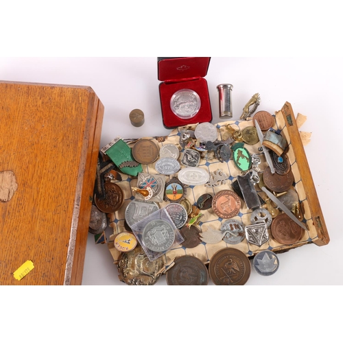 457 - Coins, medals and badges to include a Canadian dollar 1980 boxed, Bucks County Rifle Association med... 