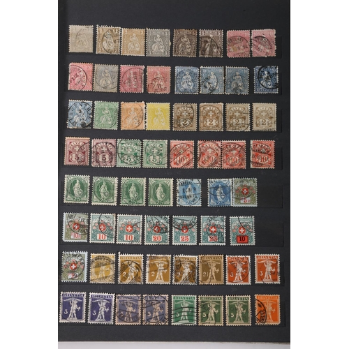 466 - SWITZERLAND, a Swiss stamp collection held in four albums to include an album of mint issues from 19... 